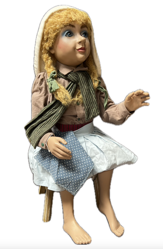 Cinderella blonde sitting on a stool
