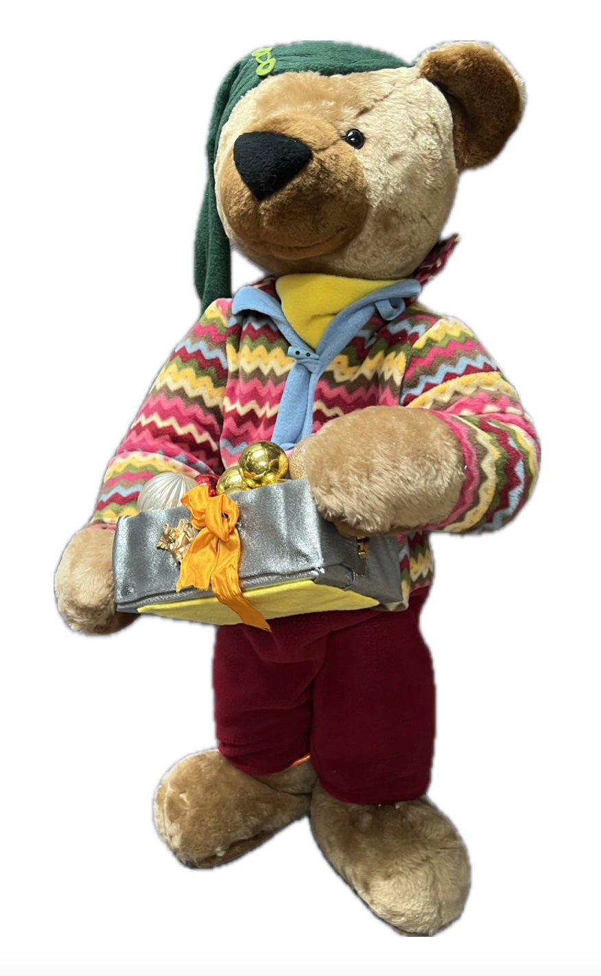 Teddy bear with green hat and gift package with balls 