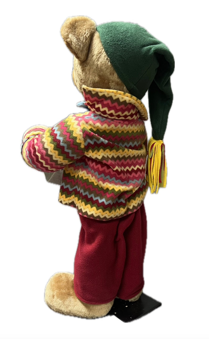 Teddy bear with green hat and gift package with balls 