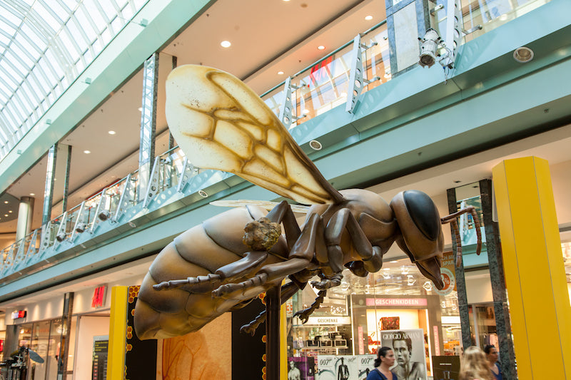 Bee 250 times enlarged on revolving stage