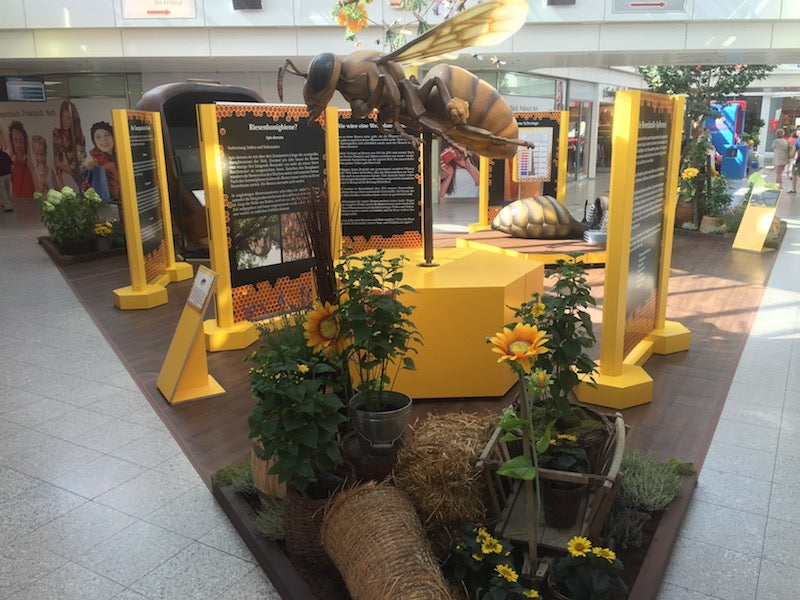 Bee 250 times enlarged on revolving stage