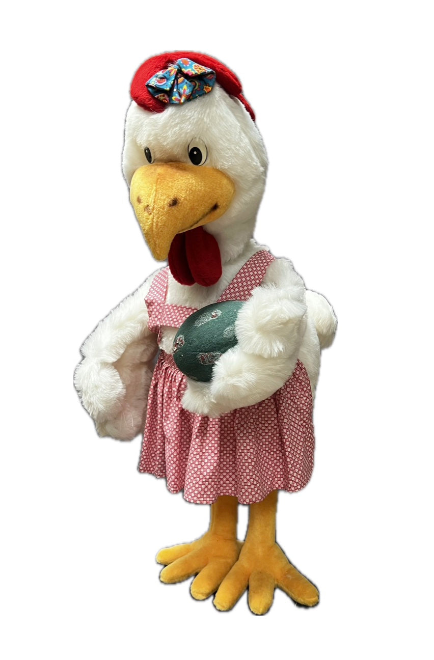 Chicken with pink apron and egg