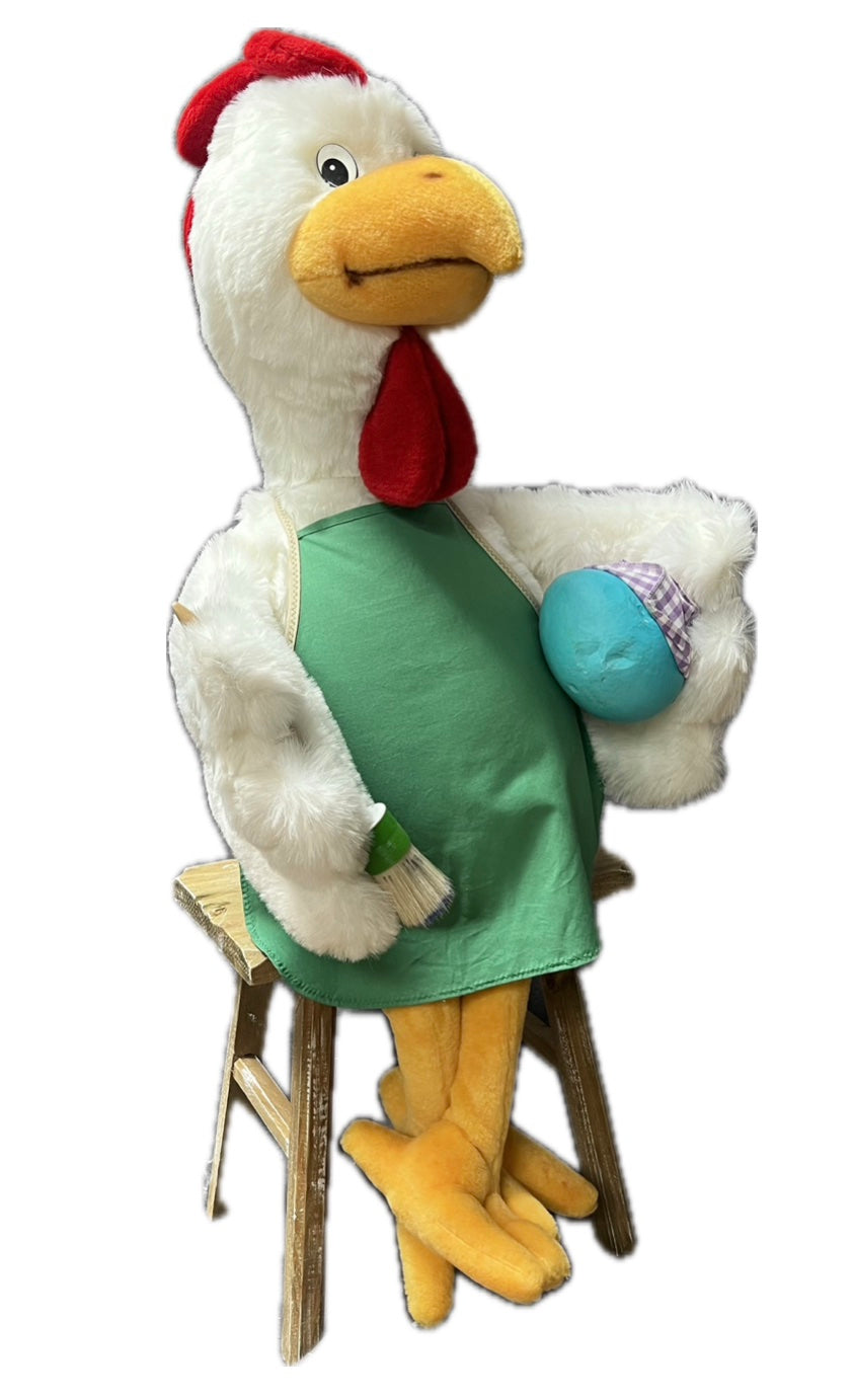 Chicken with green apron and egg
