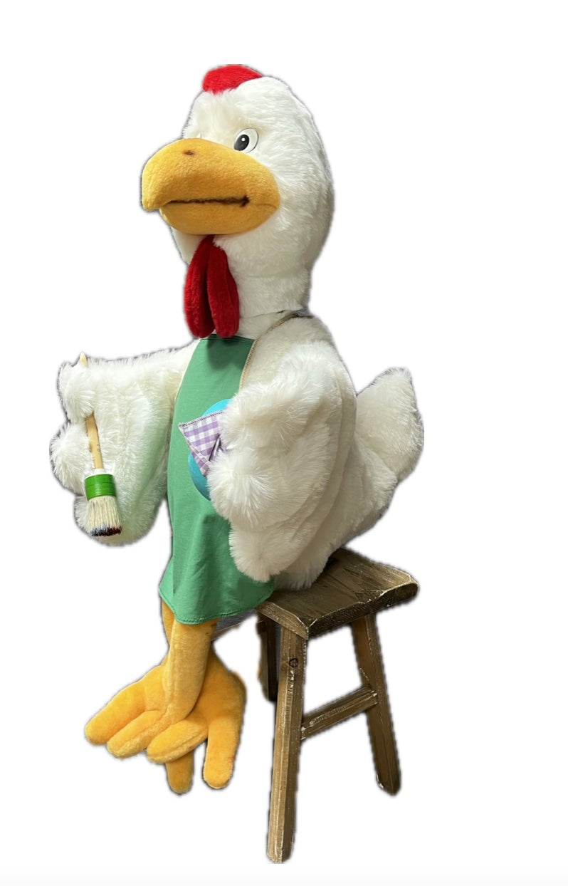 Chicken with green apron and egg