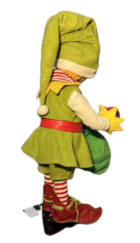 Elf with button eyes and a gift sack 