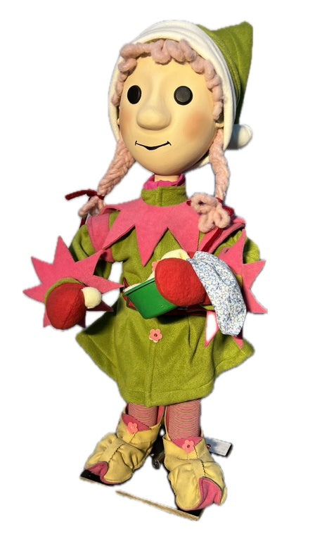 Elf girl with button eyes and pink braids and a mixing bowl (Christmas bakery) 
