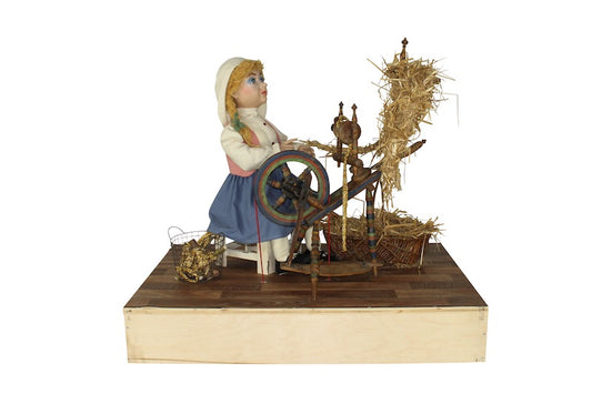 Miller's daughter at the spinning wheel from the fairy tale Rumpelstiltskin