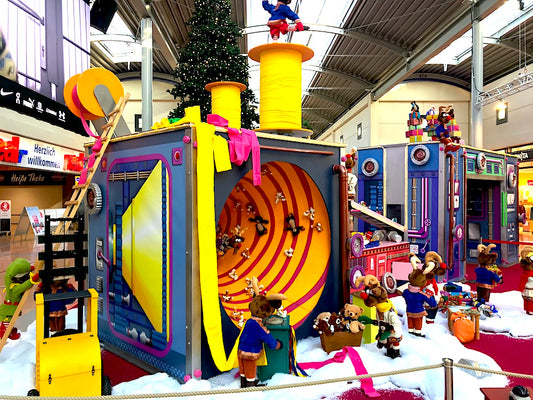 Rudi's reindeer troop wraps Christmas presents with a large machine 