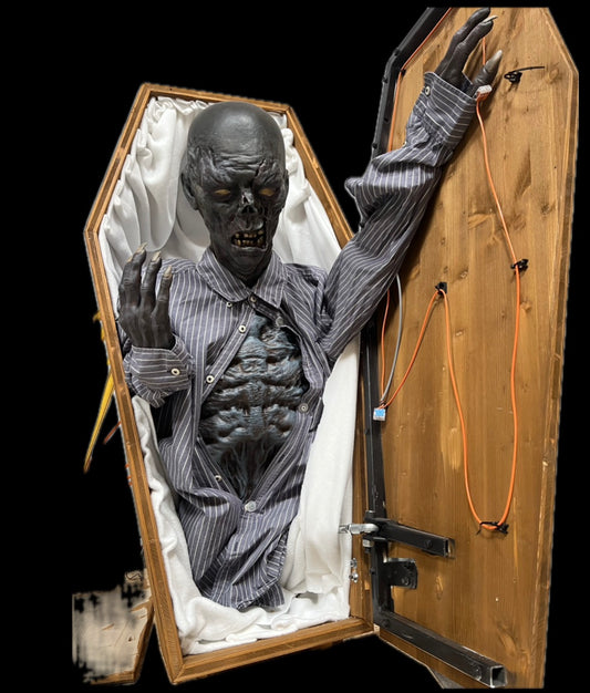 Zombie opens coffin lid